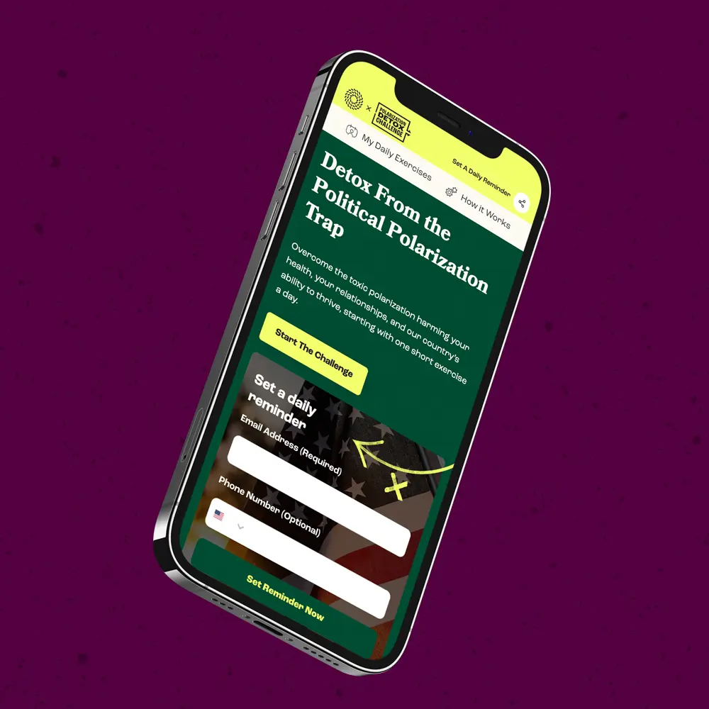 Smartphone displaying a website titled "Detox From the Political Polarization Trap," with options to set a daily reminder.